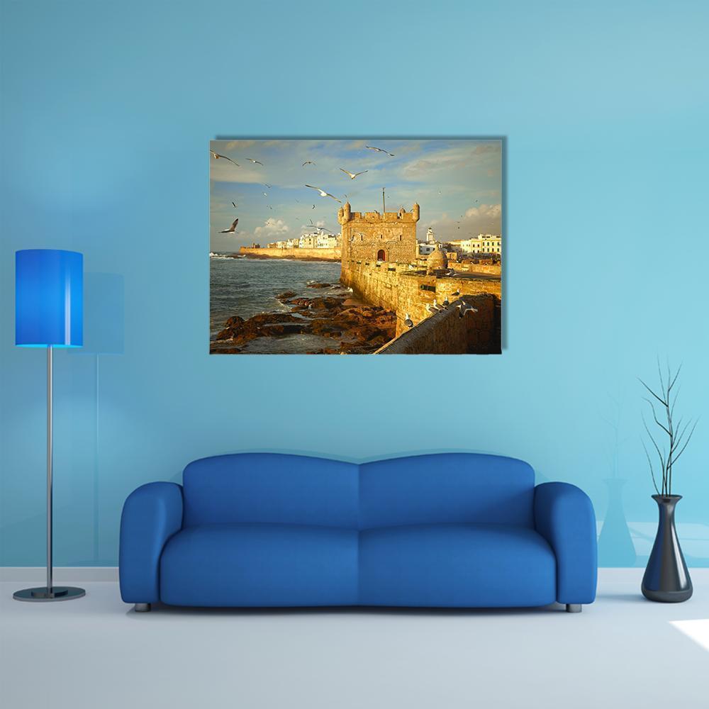 Essaouira Fortress, Morocco Canvas Wall Art in beige, brown and blue, single panel hung on a wall