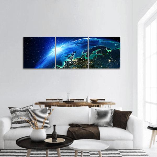 Europe from Space at Sunrise Panoramic Canvas Wall Art in black and blue, hung on a wall