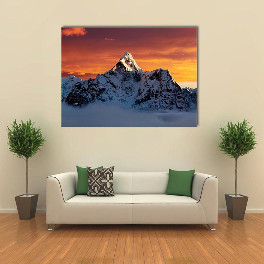 Ama Dablam at Sunset Canvas Wall Art in white, orange and blue, single panel hung on a wall
