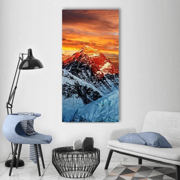 Everest at Golden Sunset Vertical Canvas Wall Art in white, orange and blue, single vertical panel hung on a wall