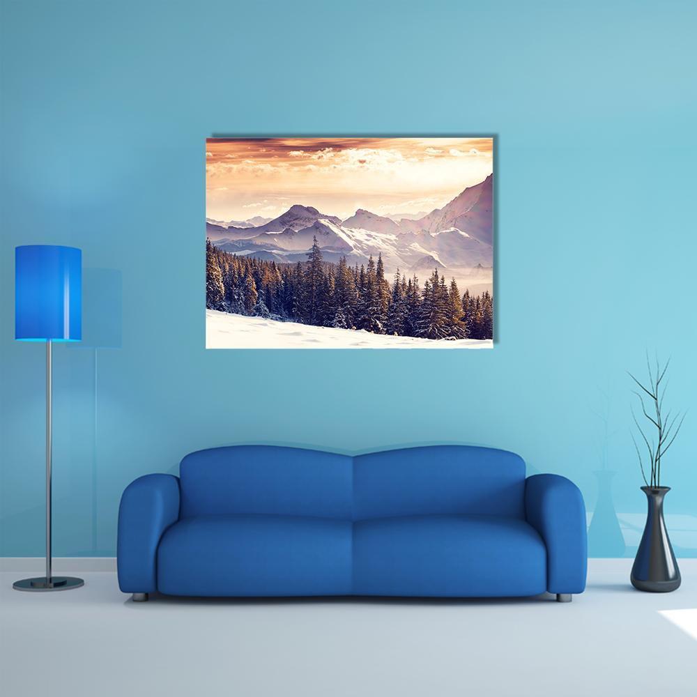 Evening Winter Mountain Landscape Canvas Wall Art in white, orange and blue, single panel hung on a wall