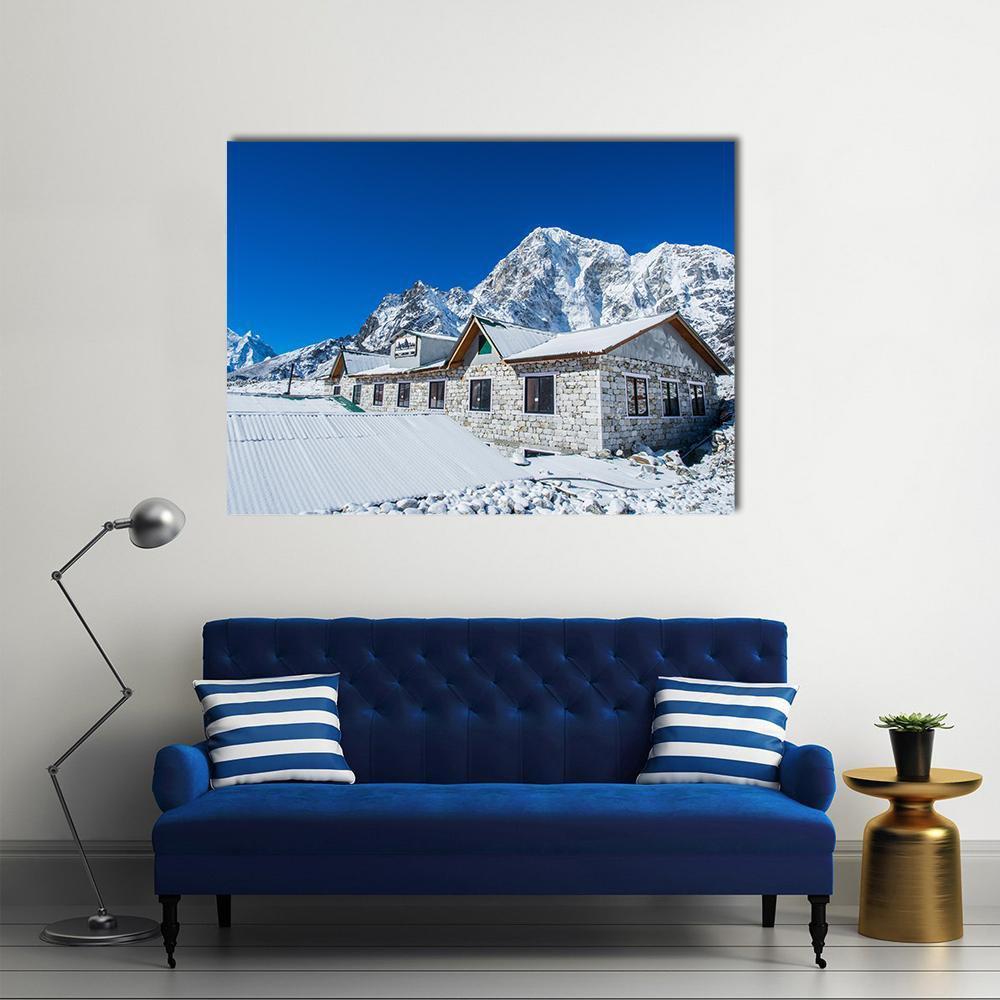 Everest Base Camp Mountain Village Canvas Wall Art in white, gray and blue, single panel hung on a wall