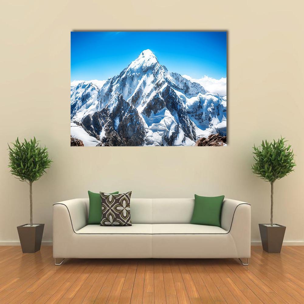 Everest Mountain Peak Canvas Wall Art in white, gray and blue, single panel hung on a wall