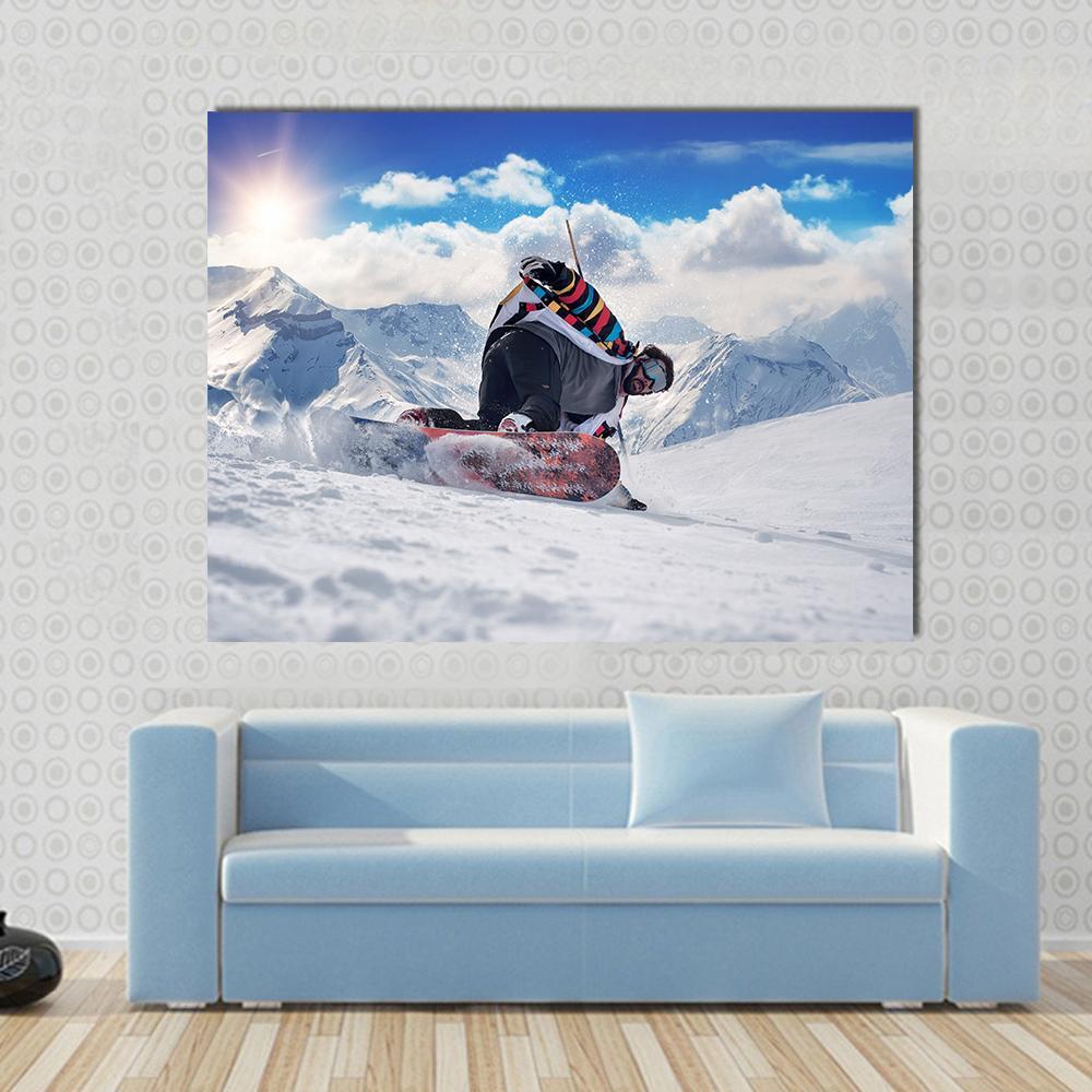 Snowboarder with Colorful Jacket and Sun Flare Canvas Wall Art in white and blue, single panel hung on a wall