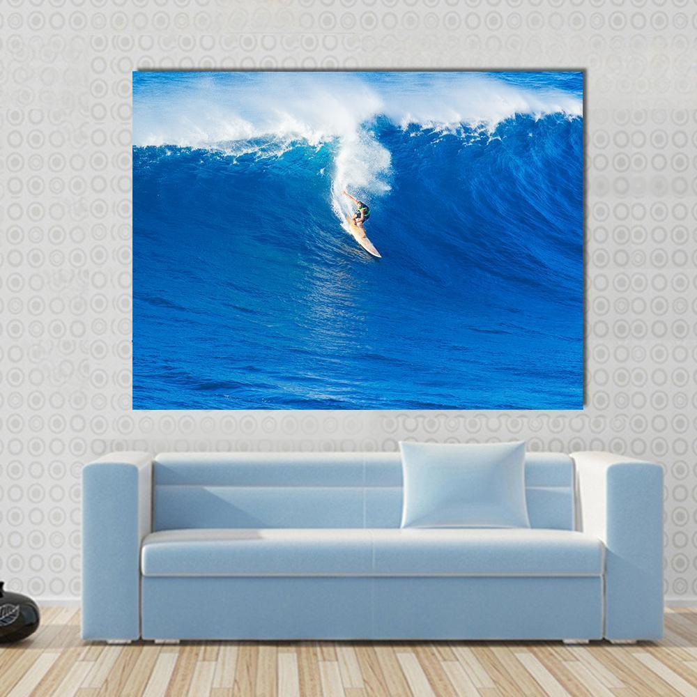 Surfer Carving Blue Wave on Tan Surfboard Canvas Wall Art in white and blue, single panel hung on a wall
