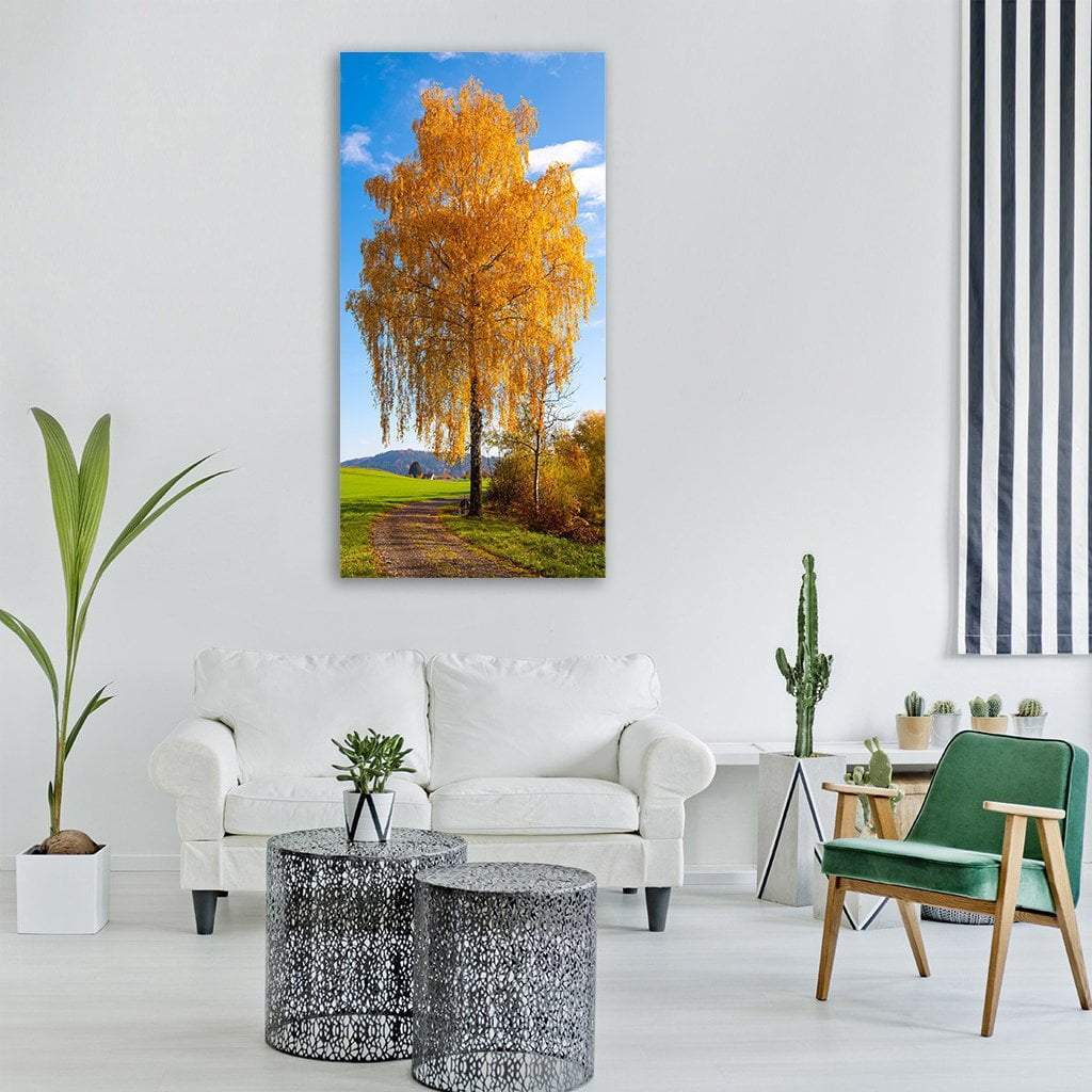 Golden Weeping Birch on Autumn Path Vertical Canvas Wall Art in gold, yellow and blue, single vertical panel hung on a wall
