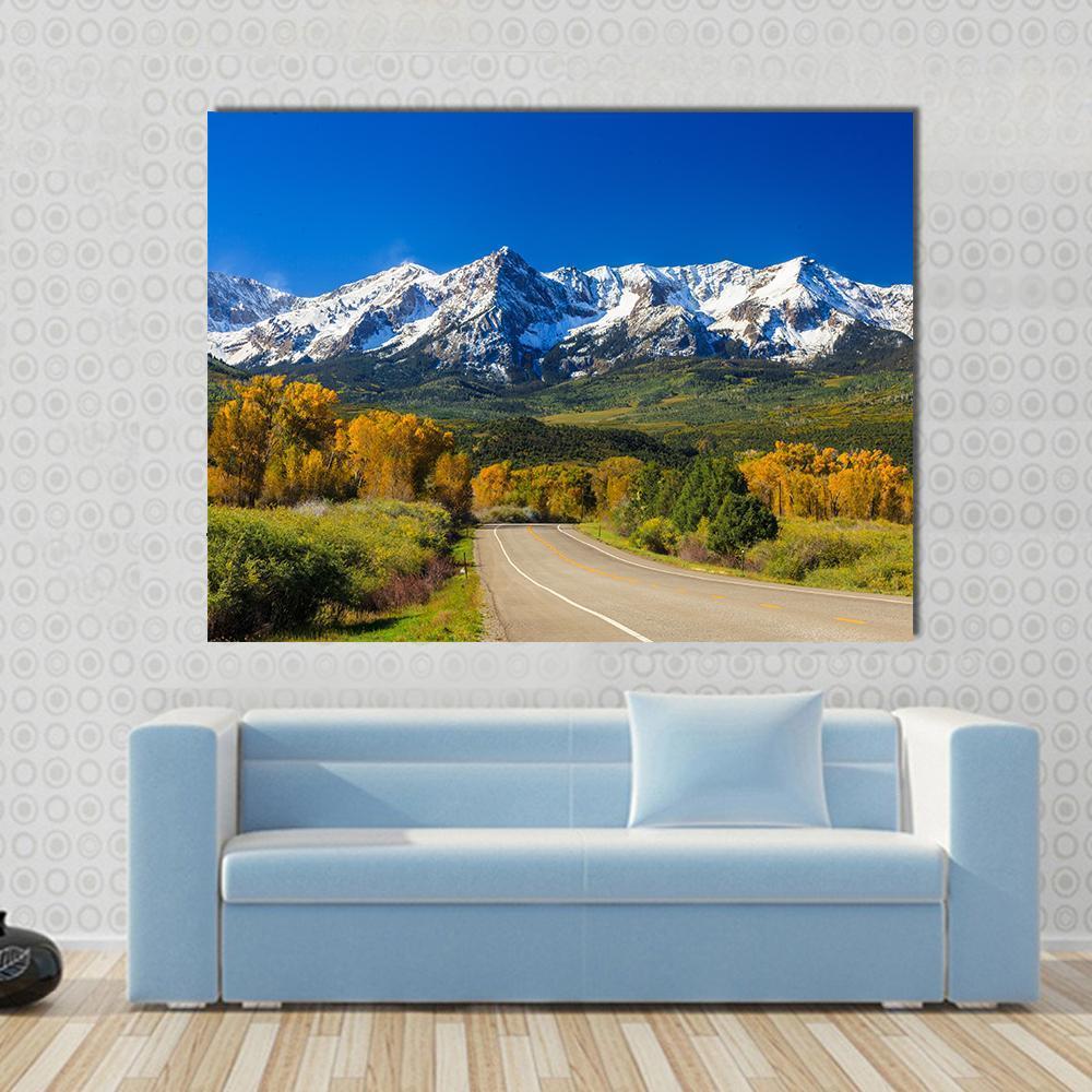 Fall Season in Colorado Canvas Wall Art in yellow, green and blue, single panel hung on a wall
