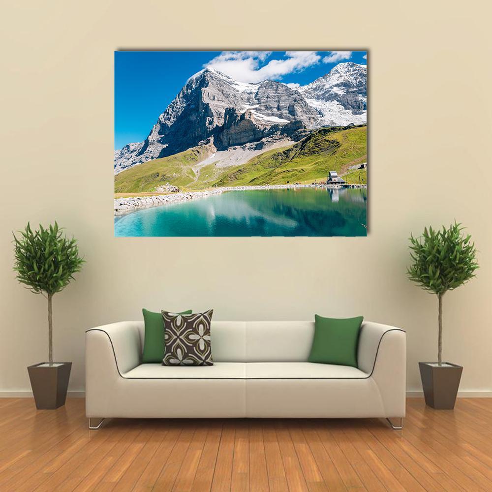 Fallbodensee Lake with Alpine Peaks Canvas Wall Art in gray, green and blue, single panel hung on a wall