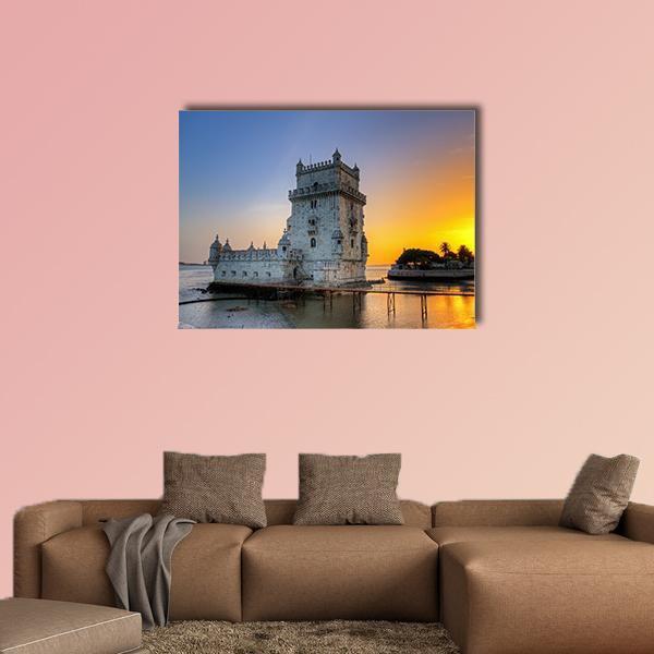 Belem Tower at Sunset Canvas Wall Art in orange, yellow and blue, single panel hung on a wall