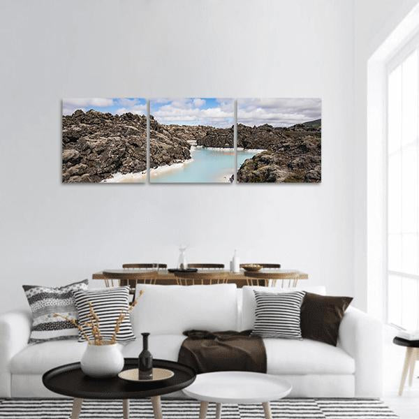 Blue Lagoon Iceland Geothermal Landscape Panoramic Canvas Wall Art in black, brown and blue, hung on a wall