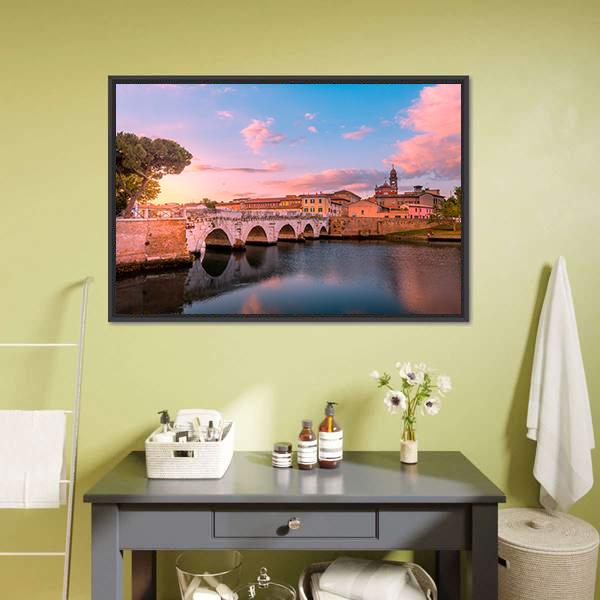 Arched Bridge Reflecting at Sunset Canvas Wall Art in orange, blue and pink, framed canvas, product view on a white background