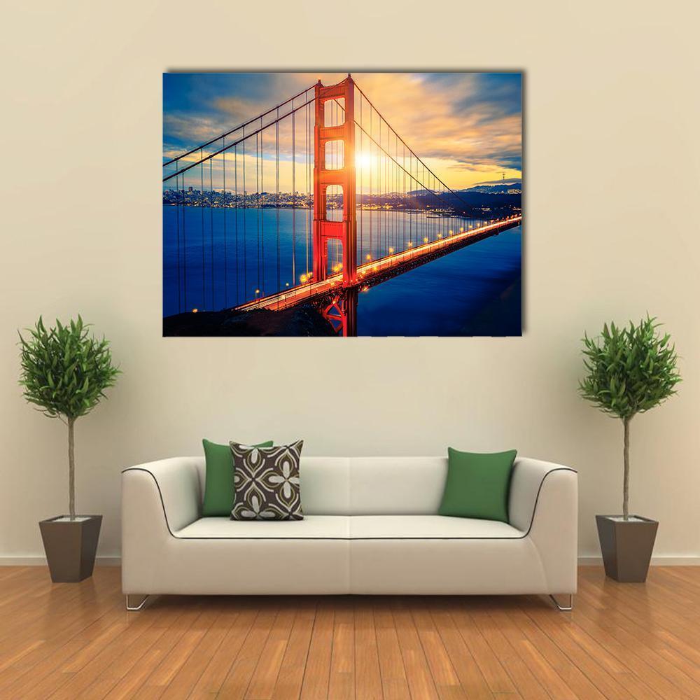 Golden Gate Bridge at Sunset Canvas Wall Art in orange, yellow and blue, single panel hung on a wall