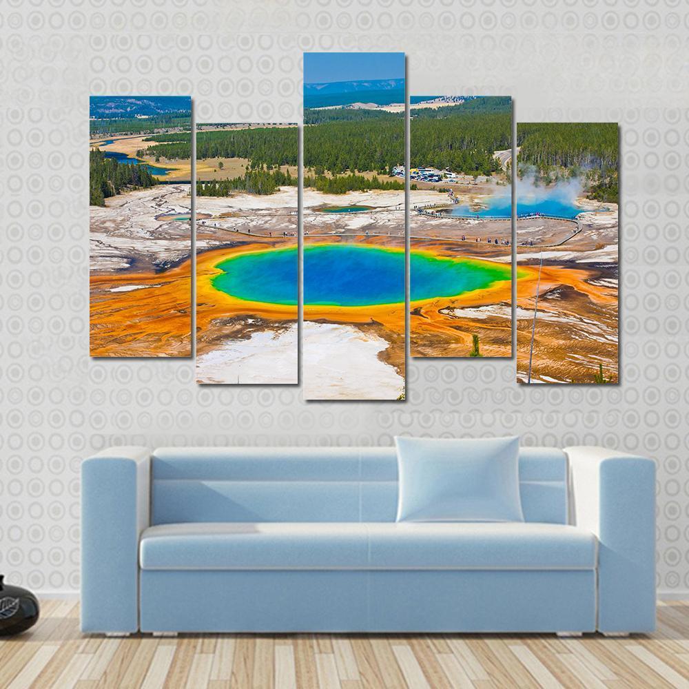 Grand Prismatic Spring Canvas Wall Art in orange, blue and multicolor, hung on a wall