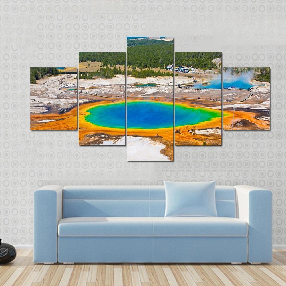 Grand Prismatic Spring Canvas Wall Art in orange, blue and multicolor, hung on a wall