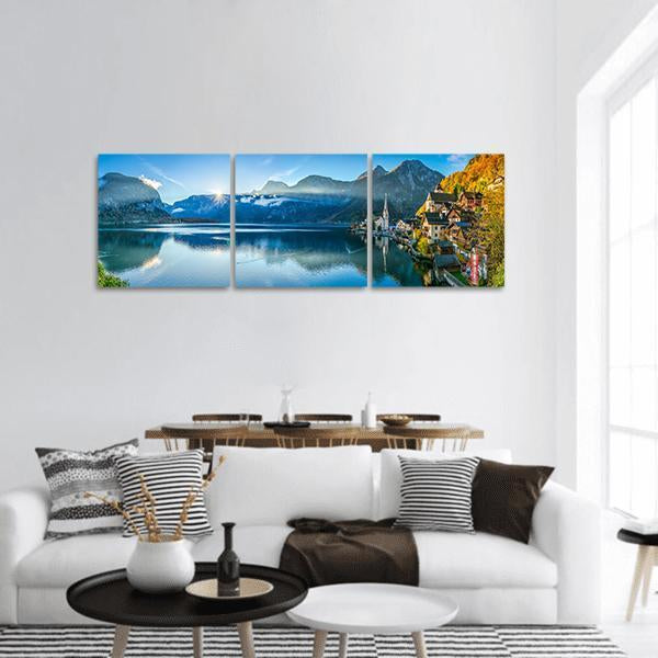 Hallstatt Lakeside Village at Sunrise Panoramic Canvas Wall Art in gray, yellow and blue, hung on a wall