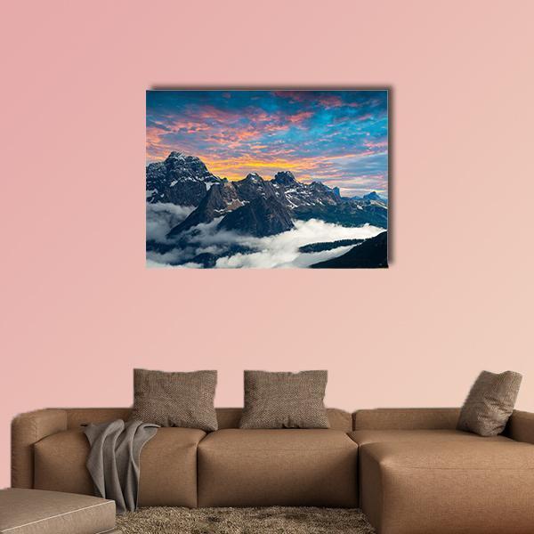Snow-capped Italian Peaks at Sunset Canvas Wall Art in orange, blue and pink, single panel hung on a wall