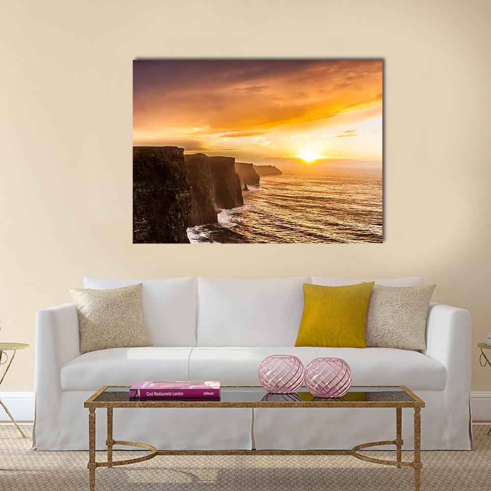 Cliffs of Moher at Sunset Canvas Wall Art in brown, orange and yellow, single panel hung on a wall