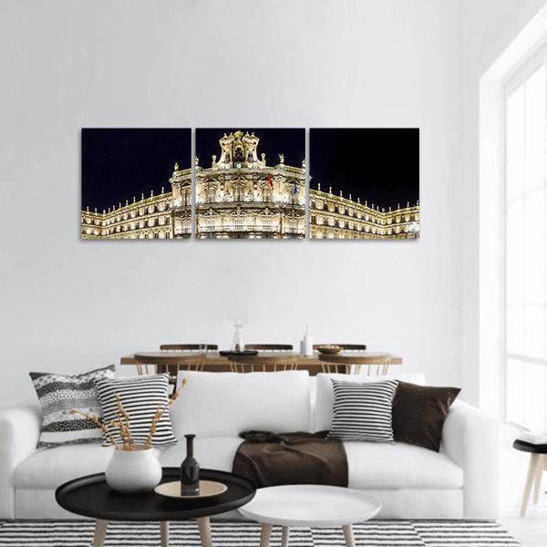 Plaza Mayor at Night Panoramic Canvas Wall Art in black, gold and yellow, hung on a wall