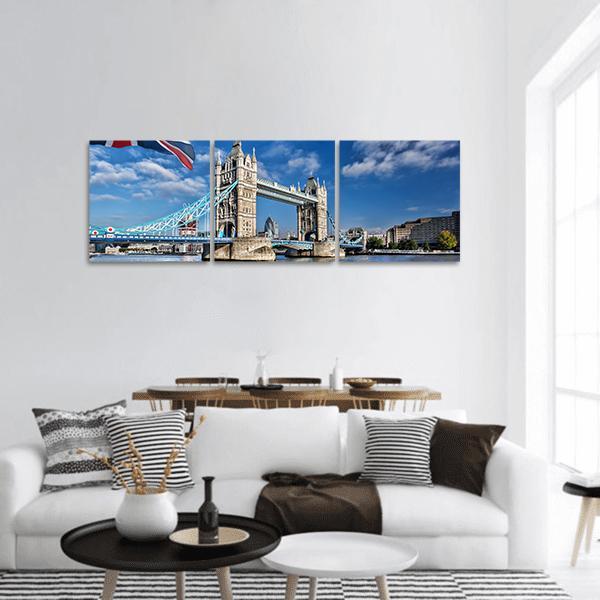Tower Bridge Over the Thames, London Panoramic Canvas Wall Art in white, beige and blue, hung on a wall