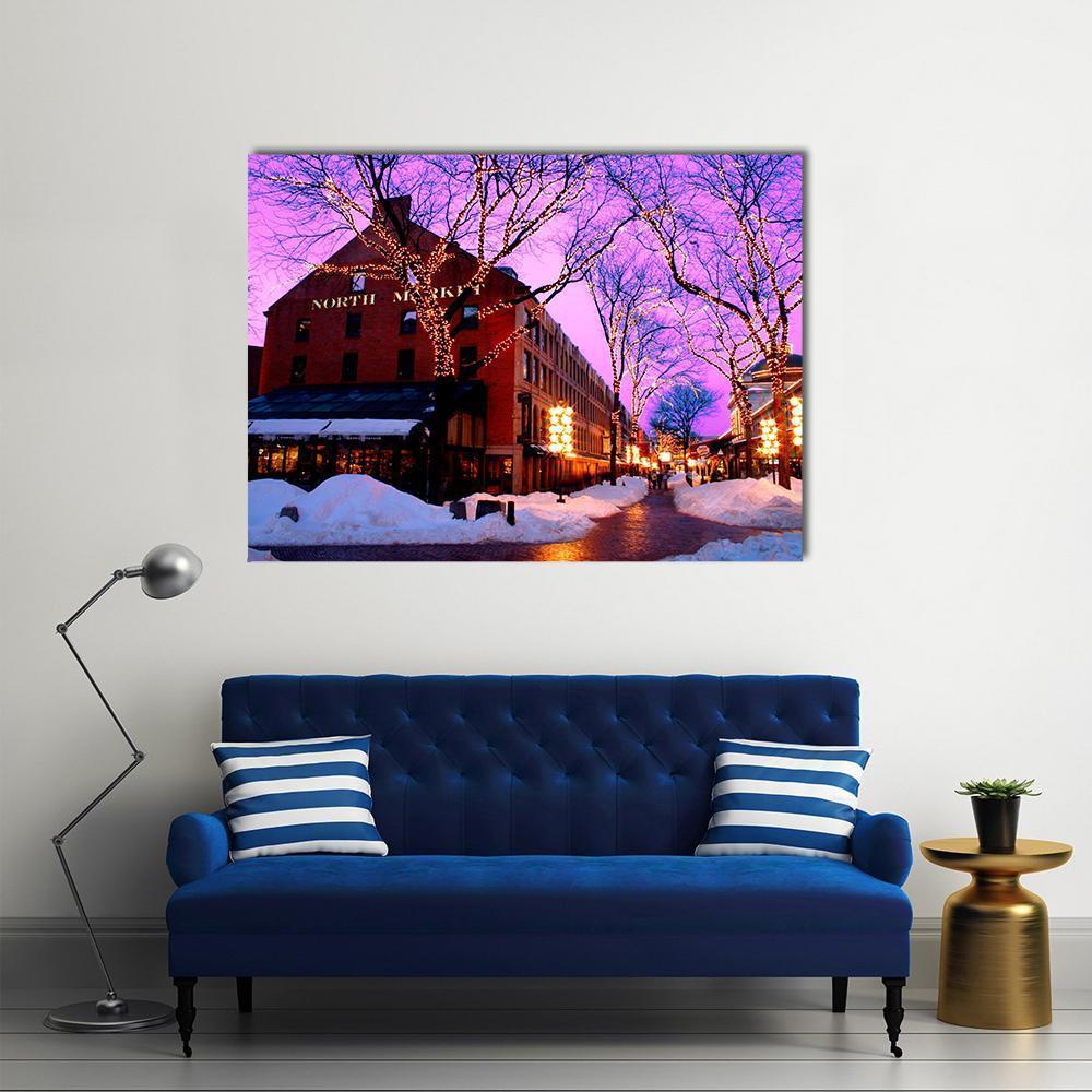 North Market Snowy Street at Twilight Canvas Wall Art in white, orange and purple, single panel hung on a wall