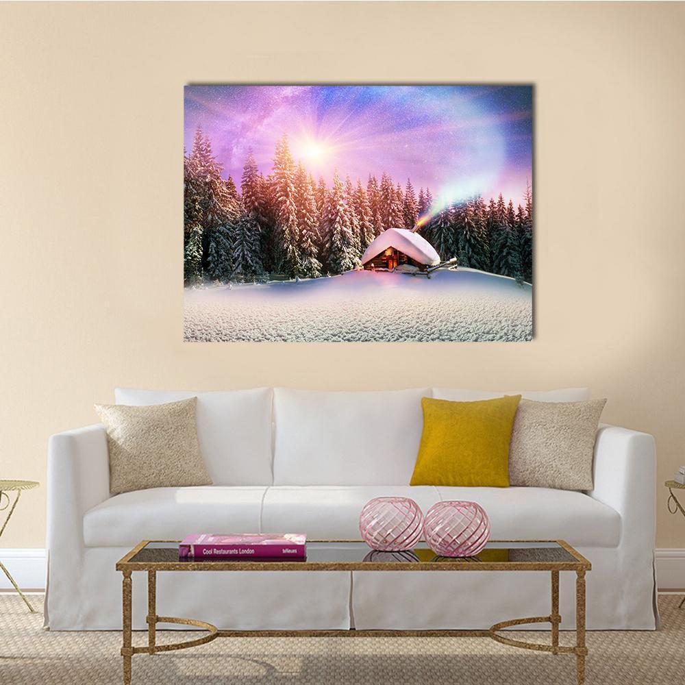 Snowy Cabin Beneath Aurora Night Sky Canvas Wall Art in white, purple and pink, single panel hung on a wall