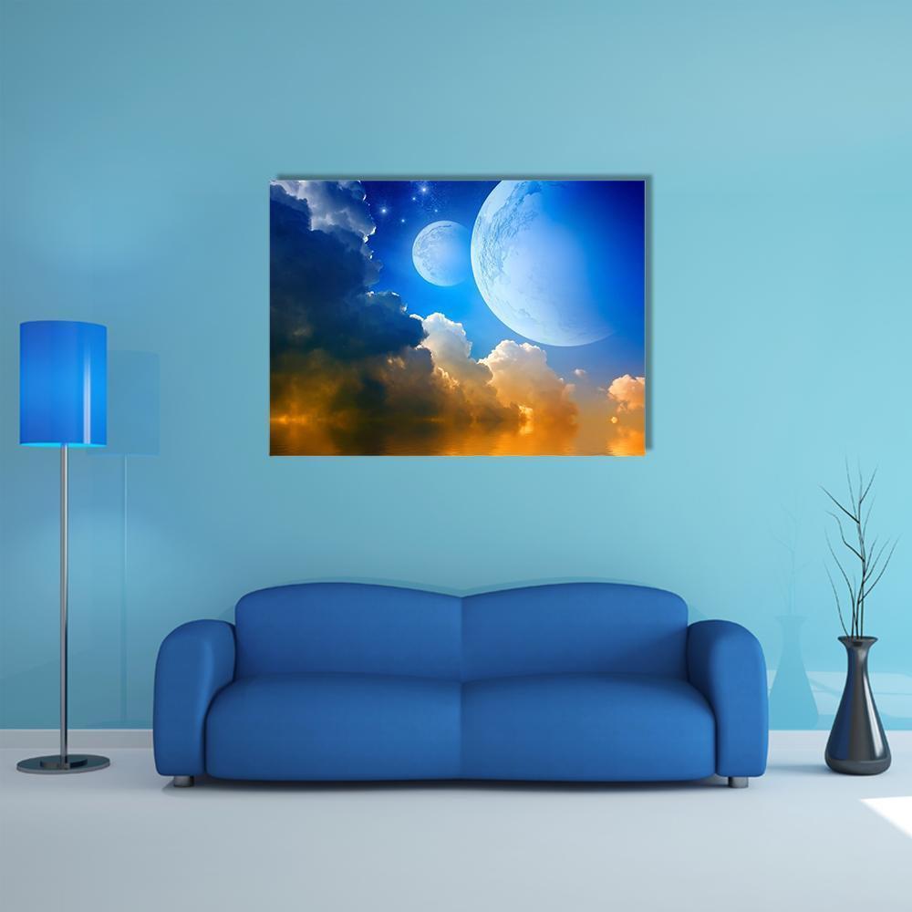 Two Moons and Glowing Clouds Canvas Wall Art in white, orange and blue, single panel hung on a wall