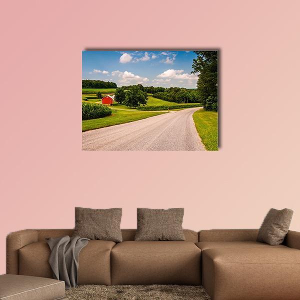 Country Road Farmhouse with Red Barn Canvas Wall Art in gray, green and blue, single panel hung on a wall
