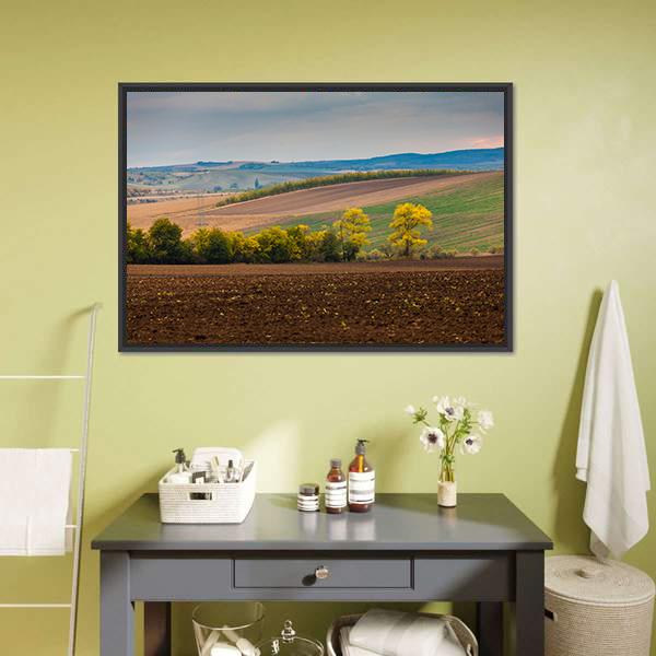Farm Landscape with Plowed Field Canvas Wall Art in brown, green and blue, framed canvas, product view on a white background