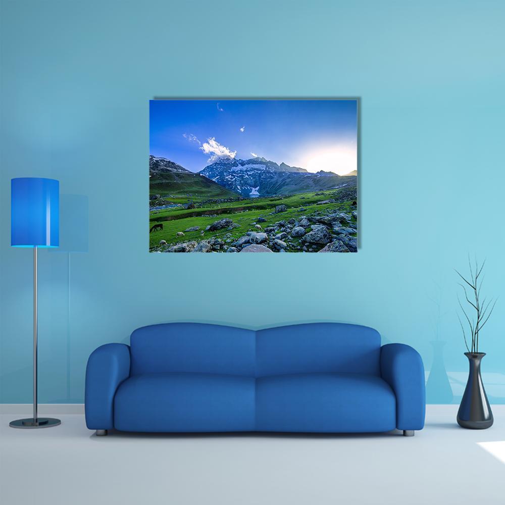 Green Farm Field with Snow-capped Mountains Canvas Wall Art in gray, green and blue, single panel hung on a wall