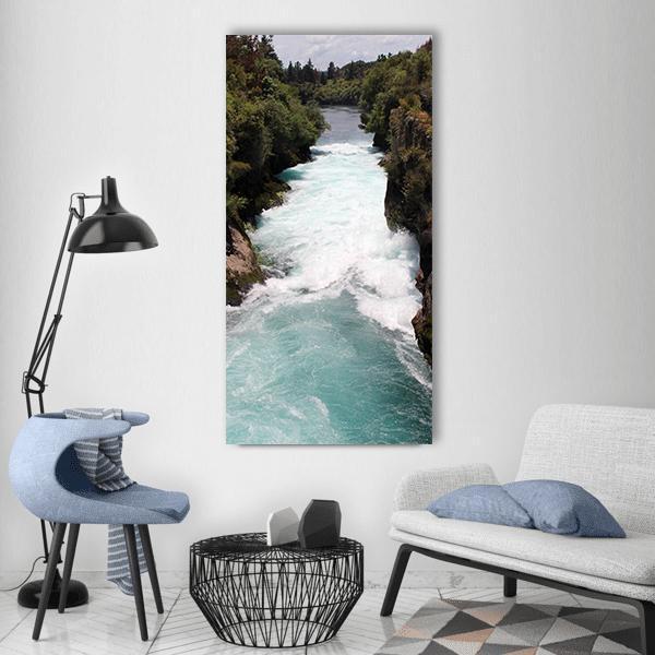 Fast Flowing Waterfall Vertical Canvas Wall Art in white, green and blue, single vertical panel hung on a wall