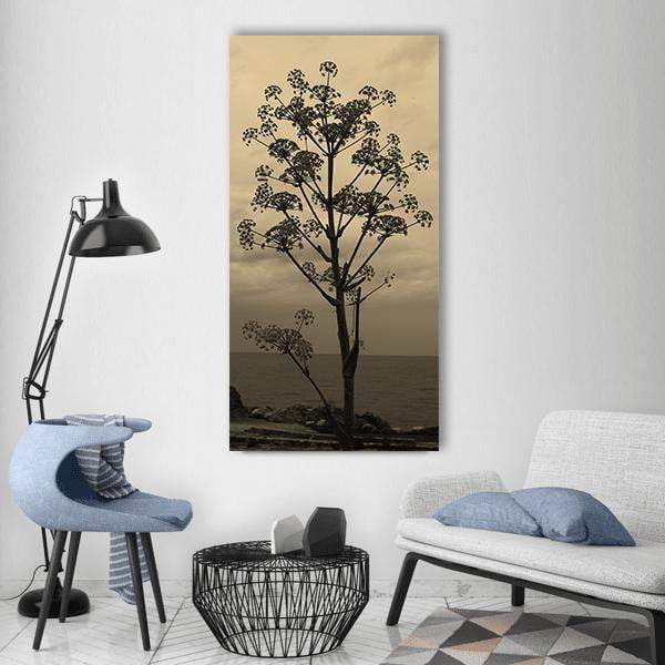 Corsican Beach with Silhouetted Sea Fennel Vertical Canvas Wall Art in black, beige and brown, single vertical panel hung on a wall