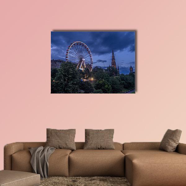 Scottish Festival Ferris Wheel at Night Canvas Wall Art in black, green and blue, single panel hung on a wall