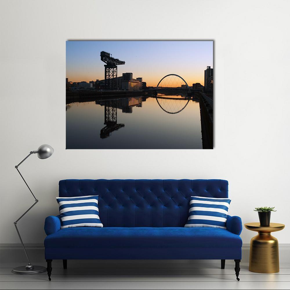 Finnieston Crane and Clyde Arc Canvas Wall Art in black, orange and blue, single panel hung on a wall