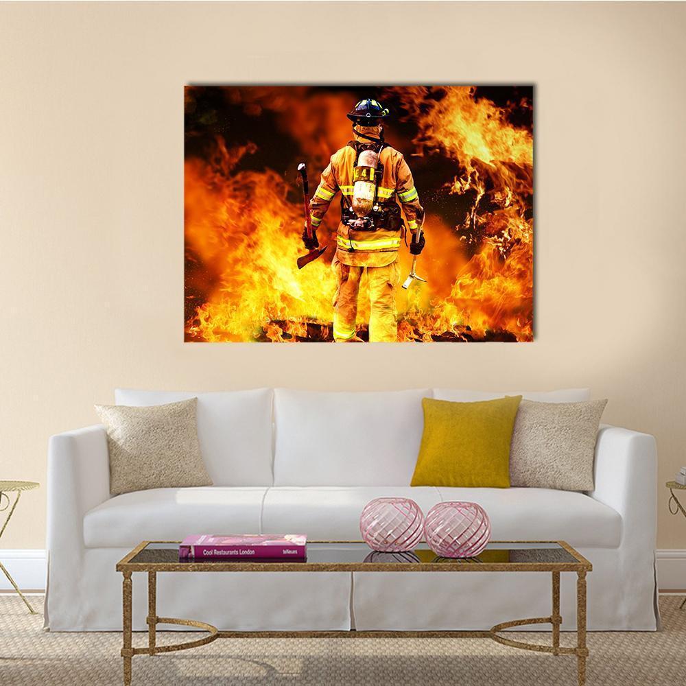 Firefighter Amid Intense Flames Canvas Wall Art in black, orange and yellow, single panel hung on a wall