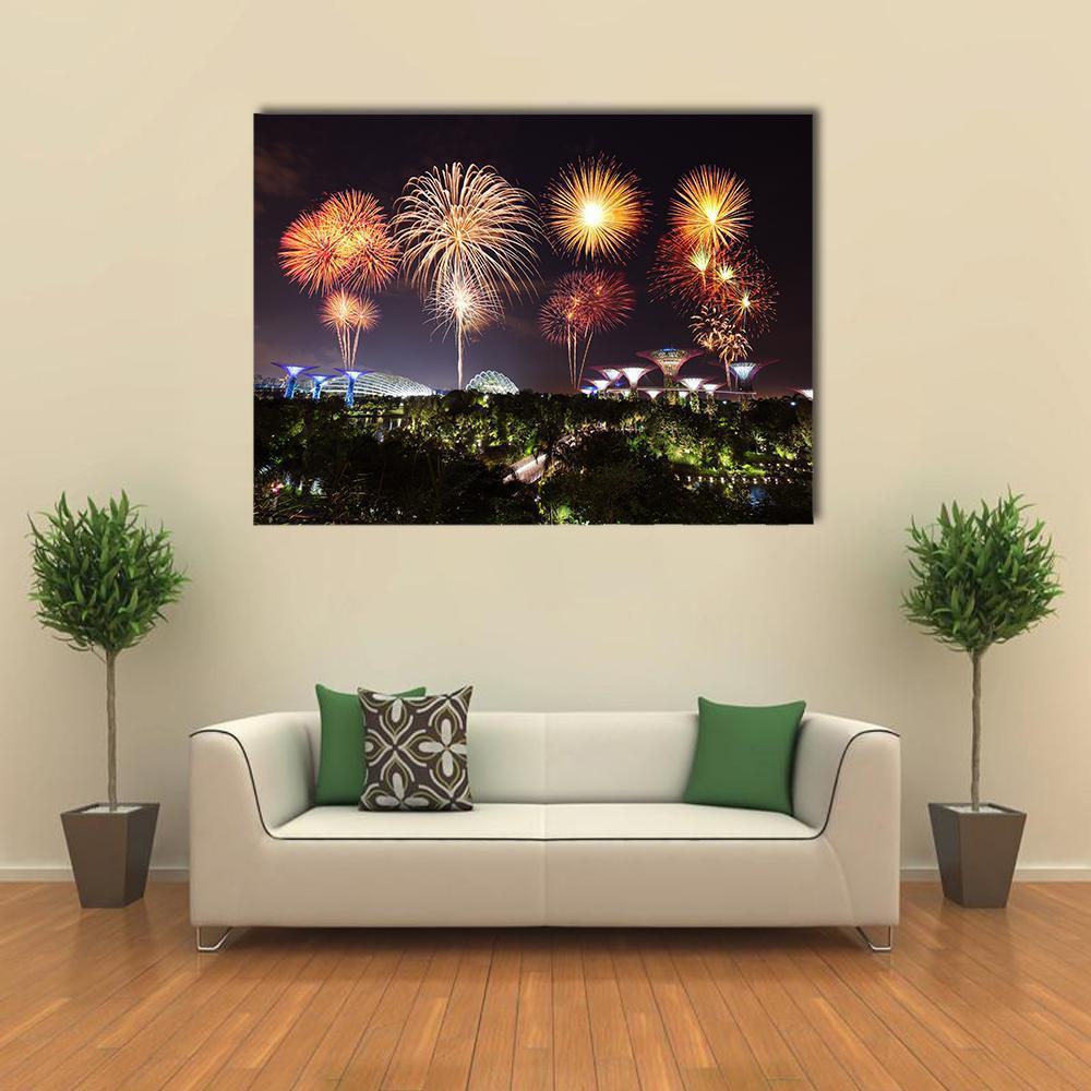 Fireworks Over Gardens by the Bay Canvas Wall Art in black, gold and orange, single panel hung on a wall