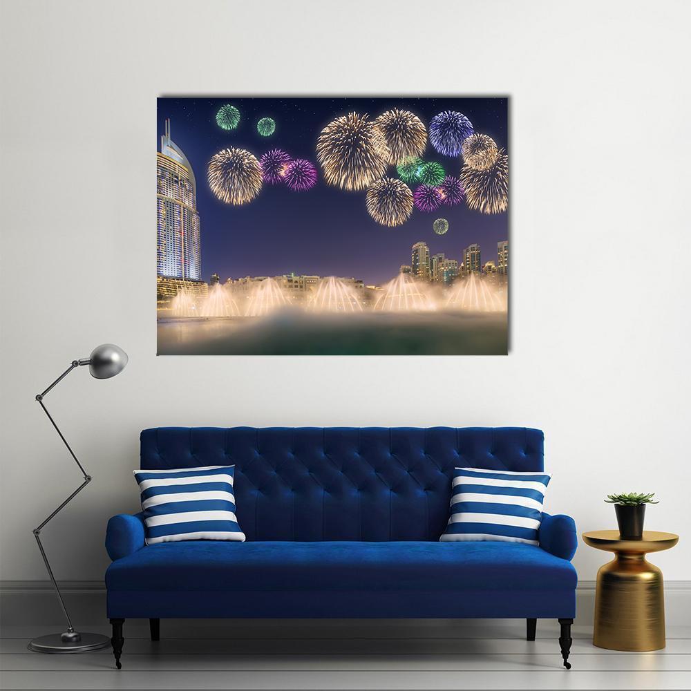 Fireworks Above Dancing Fountain Canvas Wall Art in gold, blue and navy, single panel hung on a wall