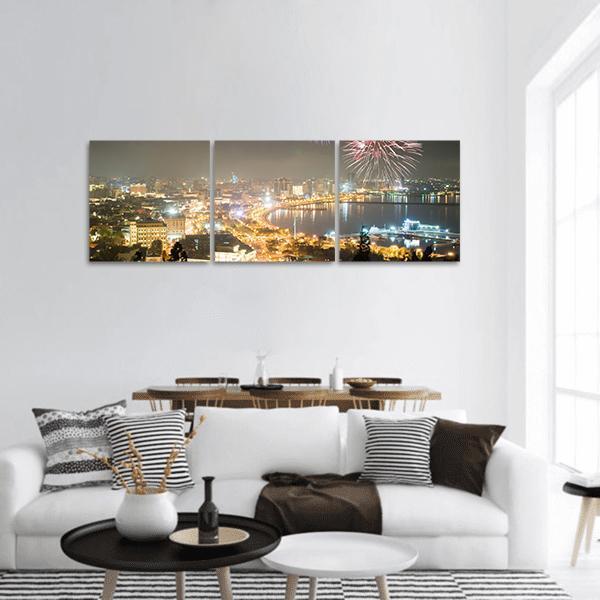 Baku Night Fireworks Over Waterfront Panoramic Canvas Wall Art in black, gold and yellow, hung on a wall