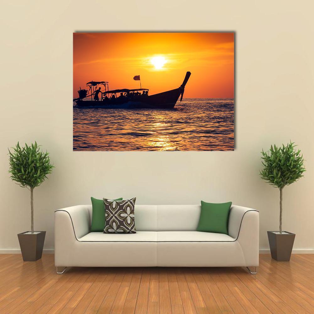 Thai Long-tail Boat at Sunset Canvas Wall Art in black, orange and yellow, single panel hung on a wall