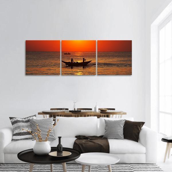Fishing Boat in Sri Lanka Panoramic Canvas Wall Art in black, orange and yellow, hung on a wall