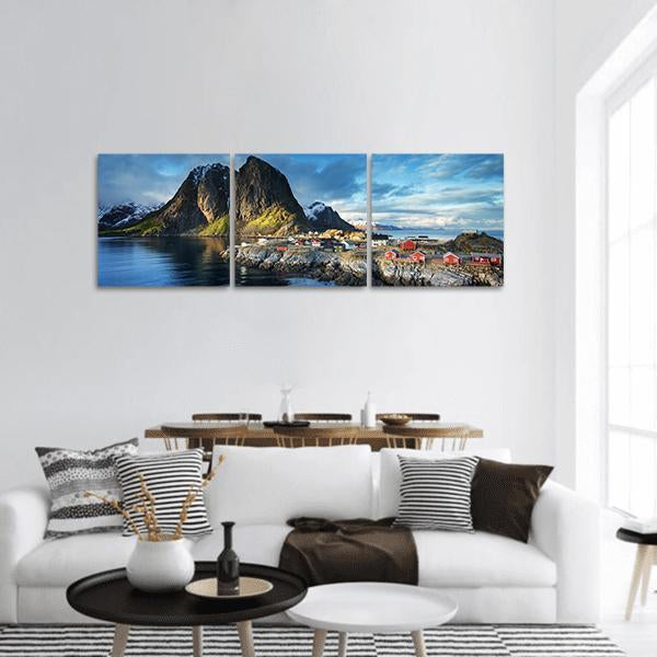 Fishing Huts in Lofoten Islands Panoramic Canvas Wall Art in gray, brown and blue, hung on a wall