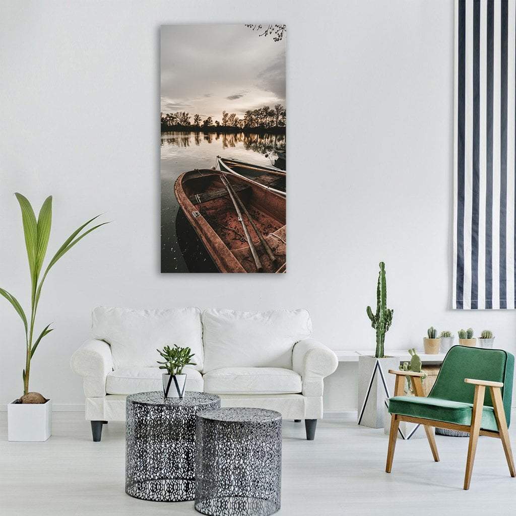 Evening Rowboat on Lake Vertical Canvas Wall Art in black, gray and brown, single vertical panel hung on a wall
