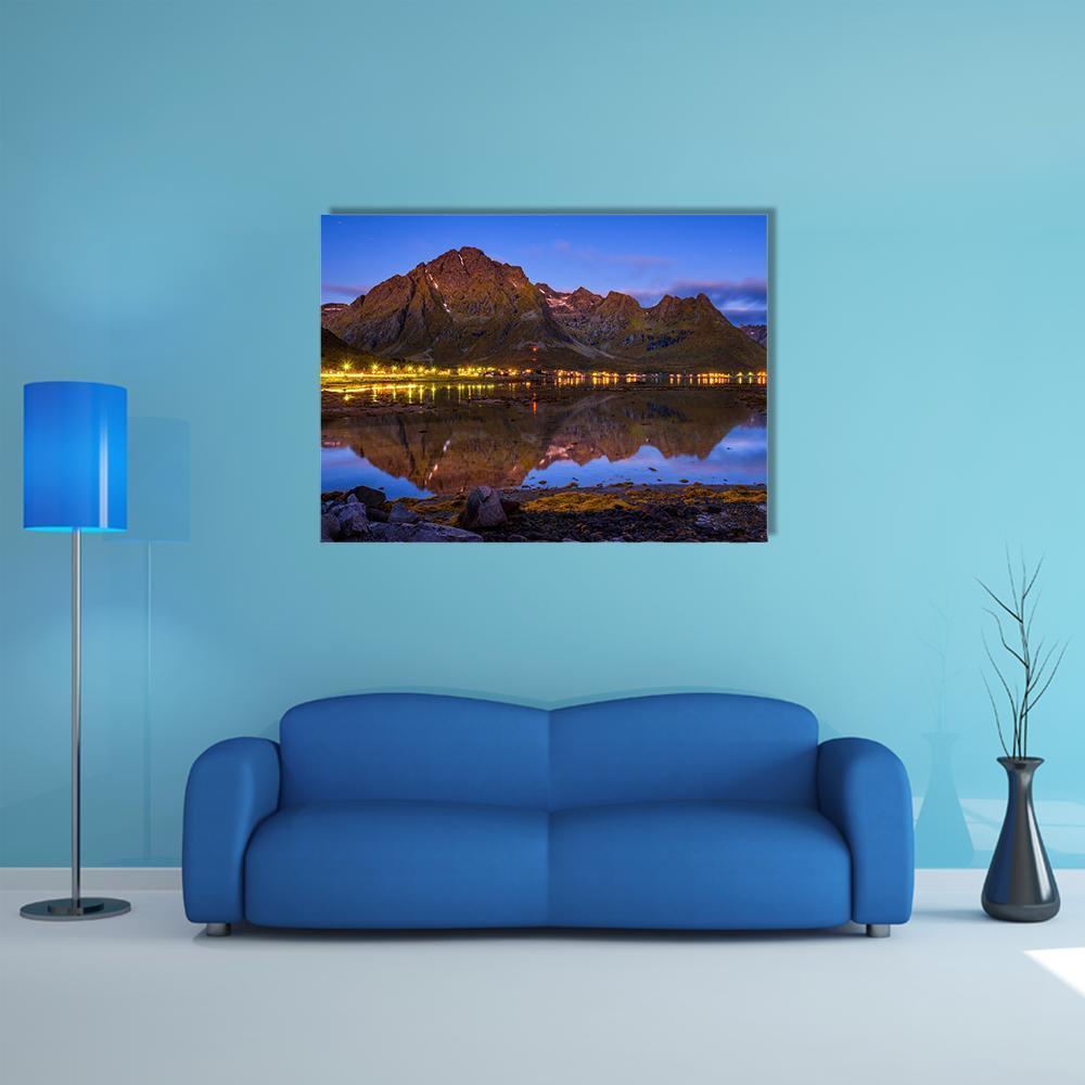 Fishing Village in Norway at Night Canvas Wall Art in orange, blue and purple, single panel hung on a wall