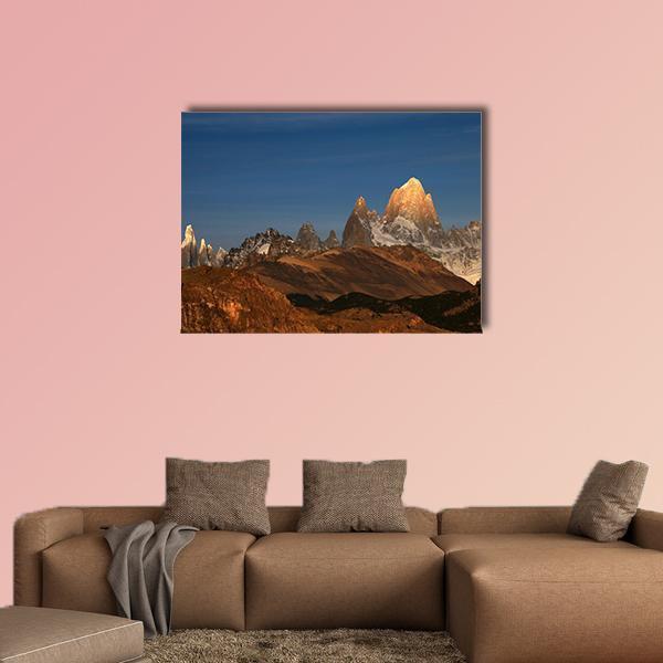 Fitz Roy at Sunrise Canvas Wall Art in brown, orange and blue, single panel hung on a wall