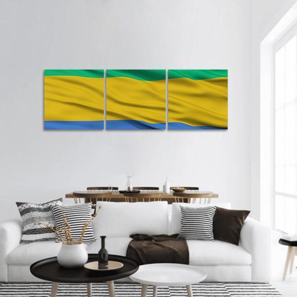 Waving Gabon Flag Panoramic Canvas Wall Art in yellow, green and blue, hung on a wall