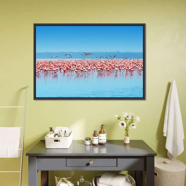 Flock of Flamingos at Lake Nakuru Canvas Wall Art in blue and pink, framed canvas, product view on a white background
