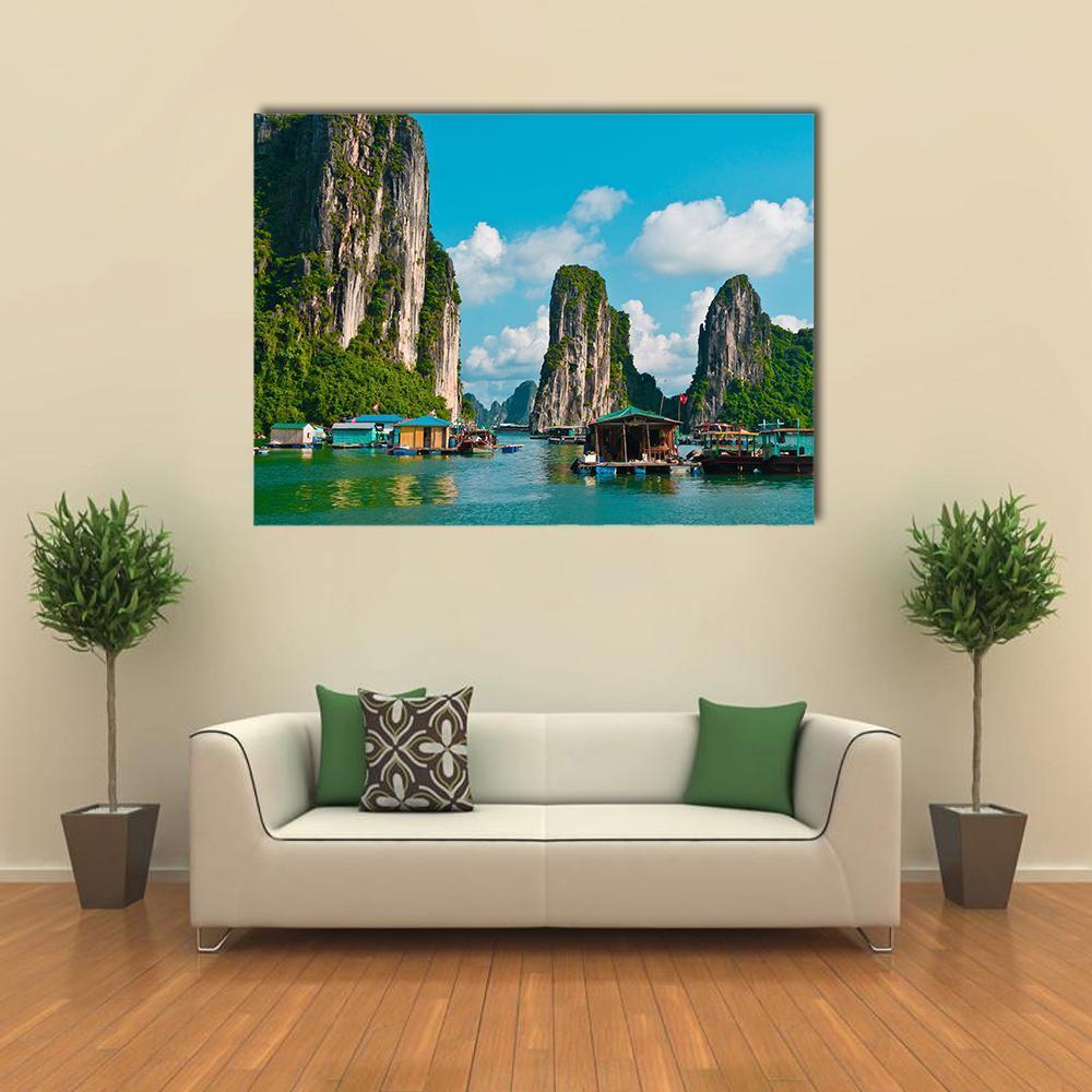 Floating Fishing Village Canvas Wall Art in gray, green and blue, single panel hung on a wall