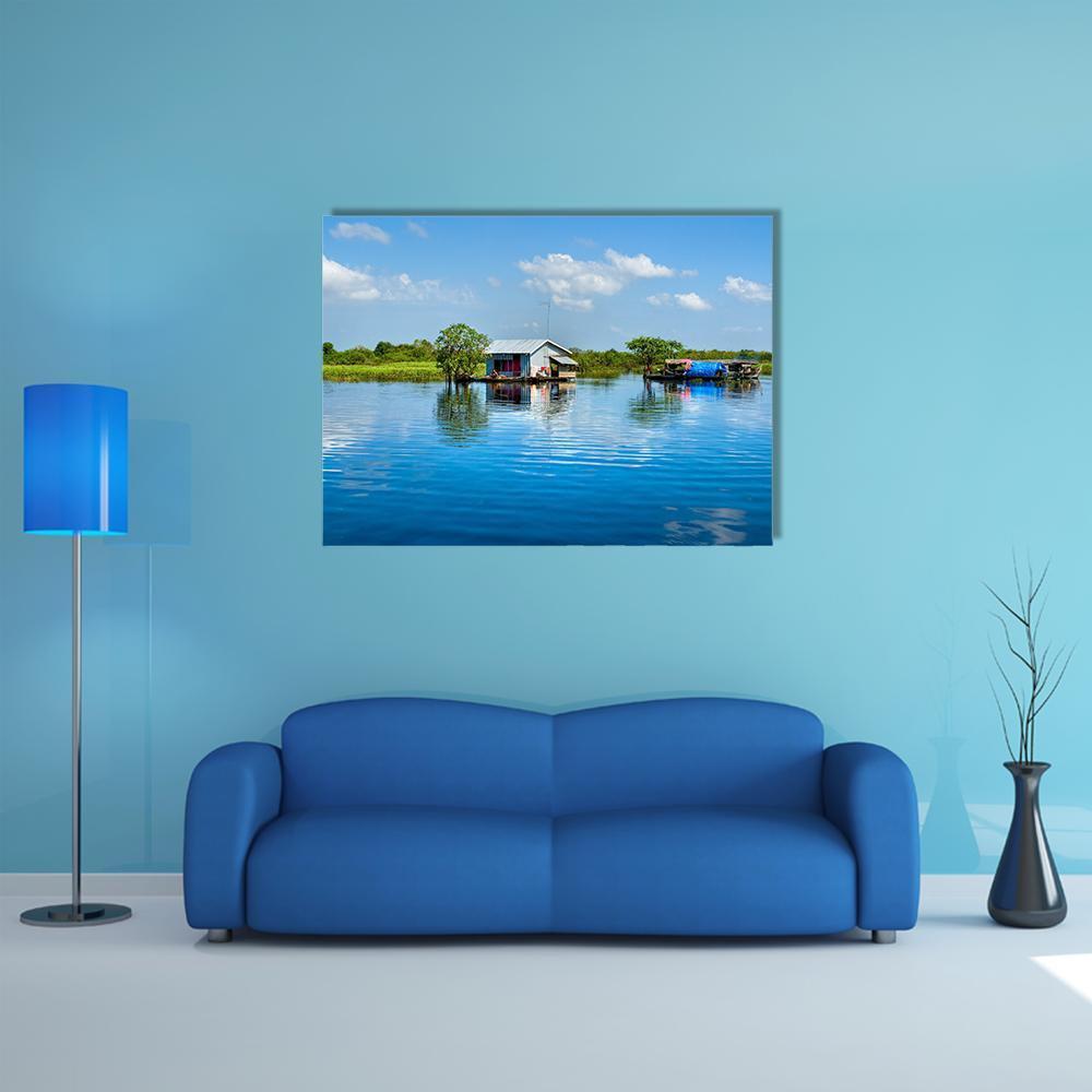 Floating House on Lake Canvas Wall Art in white, green and blue, single panel hung on a wall