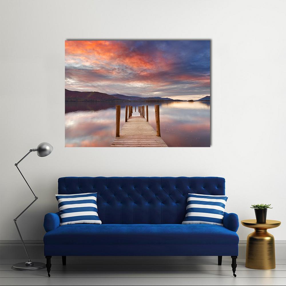 Flooded Jetty at Sunset Canvas Wall Art in orange, blue and purple, single panel hung on a wall