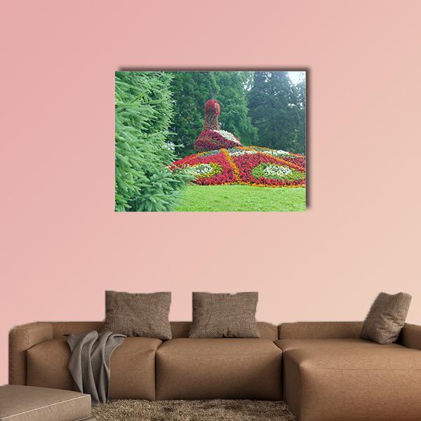 Floral Peacock Sculpture Canvas Wall Art in red, green and multicolor, single panel hung on a wall