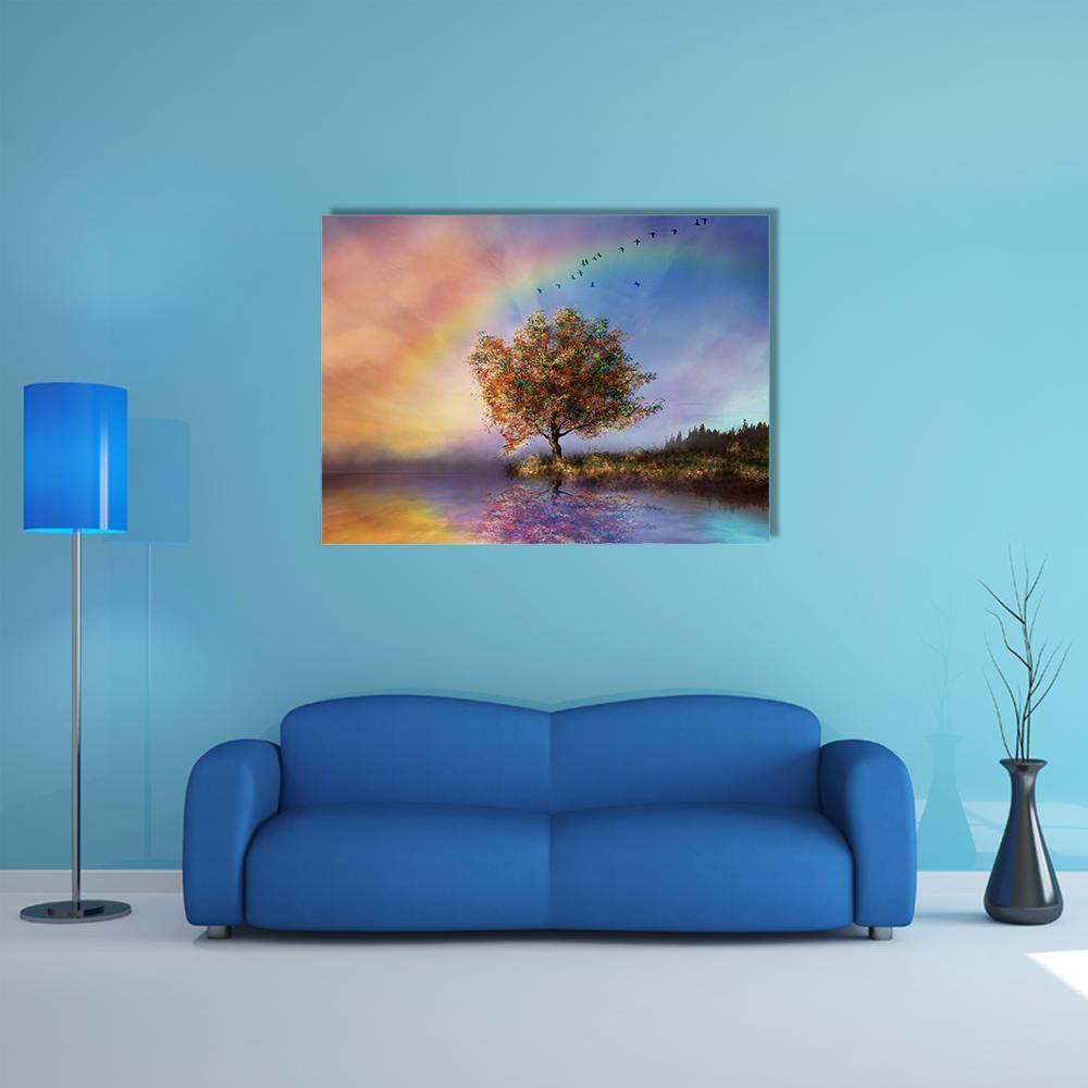 Flowered Tree with Rainbow Over Lake Canvas Wall Art in yellow, blue and multicolor, single panel hung on a wall